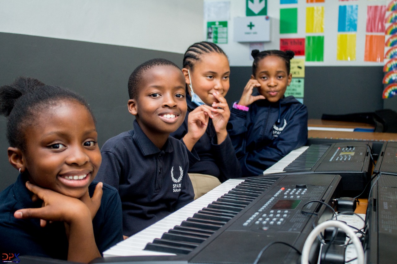 Group of kids learning piano at Modul8 Academy, Germiston